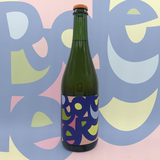 Green bottle with colorful label against a multicolored abstract background