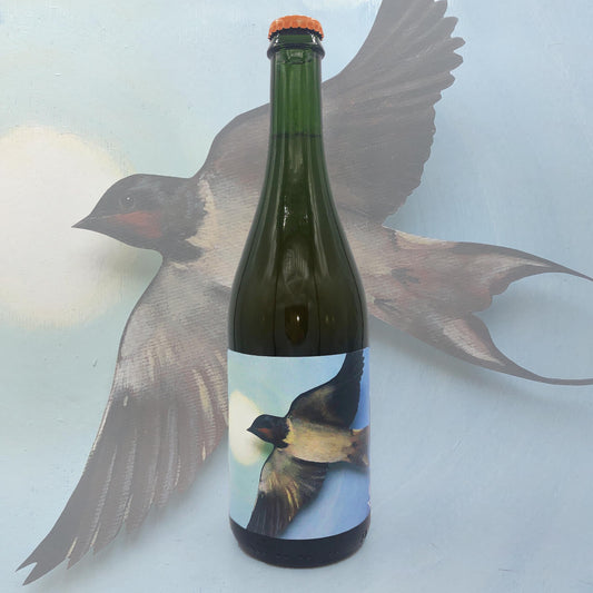 Green wine bottle with bird label against a light background